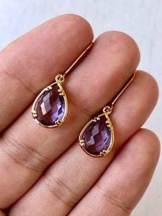 Amethyst Earrings, February Birthstone, Purple Teardrop Gem Earrings in Gold or Silver, Purple Jewelry, Lavender Earrings, Gift for women These small but gorgeous earrings feature deep purple amethyst teardrops bezel framed in either 14k gold filled or sterling silver. The teardrops are suspended form lever back ear wires in the finish of your choice. These are small, delicate and dainty earrings but with a gorgeous lavender color sure to match many outfits. Ideal for a girl or a women that like Elegant Amethyst Teardrop Dangle Earrings, Purple Gemstone Teardrop Earrings, Elegant Lavender Earrings With Ear Wire, Elegant Purple Teardrop Crystal Earrings, Purple Gemstone Teardrop Dangle Earrings, Purple Teardrop Gemstone Earrings, Amethyst Teardrop Crystal Earrings, Lavender Teardrop Earrings With Ear Wire, Formal Amethyst Teardrop Earrings