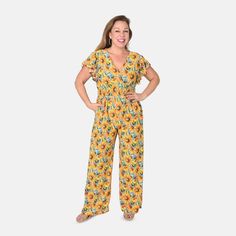 Buy Tamsy Yellow Sunflower Smocked Waist Jumpsuit with Flutter Sleeve - One Size Fits Most at ShopLC. V-neck Jumpsuits And Rompers With Smocked Back For Vacation, Casual Summer Jumpsuit With Flutter Sleeves, Vacation Ruffled Short Sleeve Jumpsuits And Rompers, Short Sleeve Ruffled Jumpsuits And Rompers For Vacation, Beach Jumpsuits And Rompers With Ruffles And Short Sleeves, Short Sleeve Ruffled Jumpsuits For Vacation, Yellow Ruffled Jumpsuits And Rompers For Summer, Summer Jumpsuits And Rompers With Ruffles, Summer Jumpsuit With Ruffles And Short Sleeves