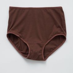 A modern take on a classic silhouette. Feminine and comfortable, the high brief wears well under dresses thanks to its sleek lines while the lightweight, jersey cotton fabric is incredibly soft against skin. Hits just below the belly button. Full coverage bottom. 94% organic cotton, 6% spandex. Elastic trim. Cut and sewn in the U.S. Machine wash and dry. Size Guide Cotton Briefs With Wide Waistband, Cotton High-cut Leg Bottoms For Daywear, Cotton Bottoms With Wide Waistband, Cotton Bottoms With Wide Waistband, Short Length, Basic Cotton Brief Bottoms, Basic Solid Bottoms For Daywear, Seamless Cotton Brief Bottoms, Cotton Briefs With Hygienic Liner, Seamless Cotton Bottoms For Daywear