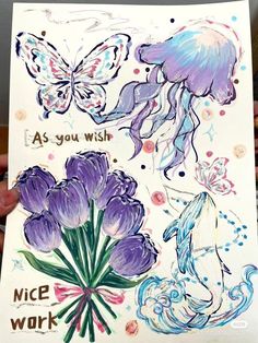 someone is holding up a card with watercolors on it and drawings of flowers