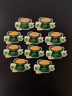 st patrick's day lepreite hat stickers on a black table top