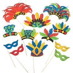 a bunch of colorful masks on sticks in the shape of flowers and leaves for masquerades or mardi gras