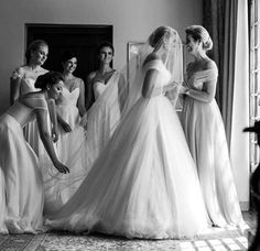 the bride and her bridesmaids are getting ready for their wedding