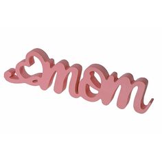 the word mom spelled in pink plastic letters on a white background with an image of a heart