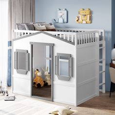 a child's bedroom with a loft bed and toys