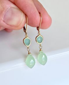 Jade and Chalcedony Earrings, Aqua and Sage Teardrop Statement Earrings in Gold or Silver, Sea Green Summer Earrings, Boho Mother's Day Gift These refreshing and light earrings feature 6 mm faceted ocean blue chalcedony oval stones bezeled set in gold filled or sterling silver and suspended from them are 12 mm natural faceted Jade teardrops. The earrings are suspended from lever back ear wires in the finish of your choice.  These are light and soft pastel colors, ideal for summer outfits, very f Elegant Green Earrings For Beach, Soft Summer Jewelry, Green Drop Earrings For The Beach, Green Faceted Earrings For Wedding, Elegant Jade Teardrop Earrings, Chalcedony Dangle Earrings With Matching Jewelry, Boho Mother, Chalcedony Earrings, Silver Gift Wrap