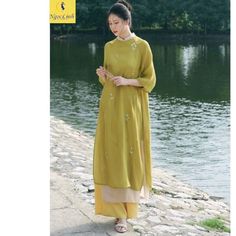 Vietnamese traditional Ao Dai, green dress, Ao Dai embroidered flowers,for Women, Girls/teen New year party ao dai. Set includes: a Traditional ao dai + a pants + Material: Branches and leaves are embroidered directly on soft silk fabric, creating a luxurious feeling. The pattern is embroidered on many color tones to help you freely choose according to your preferences.   The shirt and pants are both selected with grade 1 fabric and sewn carefully and meticulously.   The sample received is the s Summer Embroidered Ao Dai, Traditional Long Green Dress, Green Floral Embroidered Dress For Eid, Green Floral Embroidery Dress For Eid, Traditional Summer Ao Dai For Weddings, Traditional Ao Dai For Summer Wedding, Green Cheongsam For Wedding, Green Embroidered Summer Kurta, Traditional Summer Wedding Ao Dai