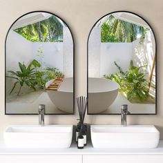 two mirrors that are on the side of a wall above a sink and bowl sinks