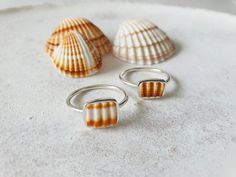 * Unique Sea Shell Fragments  have been collected, up-cycled and  set into these unique OOAK rings !  *Collected from my travels around the Greek Islands . *The sea shells are natural - Please allow for differences in color and size. *The ring's band measures 1.5cm *This ring is made to order.It will come beautifully gift wrapped for you or your beloved ! You can find more rings here : https://www.etsy.com/shop/CorneliousWhite?ref=l2-shopheader-name§ion_id=19408283 Thank you so much for stopping Silversmith Rings, Summer Rings, Silver Sea, Jewelry Tattoo, Shell Ring, Jewelry Companies, Greek Islands, Sea Shell, Cute Jewelry