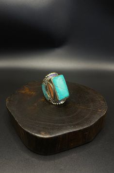 vintage handcrafted Tibetan Nepalese ring with turquoise and coral stone Artisan Multi-stone Turquoise Ring, Turquoise Multi-stone Ring For Gift, Traditional Turquoise Rings Collectible, Traditional Blue Turquoise Collectible Ring, Unique Turquoise Jewelry With Stone Setting, Unique Turquoise Multi-stone Rings, Adjustable Multicolor Turquoise Bohemian Ring, Adjustable Bohemian Turquoise Ring With Stone Setting, Spiritual Turquoise Ring With Natural Stones