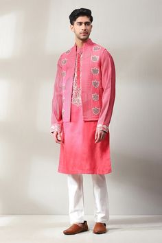 Dark pink bundi with mirror, thread embroidery in floral pattern. Paired with placket embroidered kurta and off-white pant. - Aza Fashions Traditional Mirror Work Kurta For Spring, Unstitched Chikankari Embroidery Nehru Jacket For Spring, Pink Chanderi Sherwani For Eid, Bollywood Style Pink Bandhgala With Chikankari Embroidery, Festive Pink Chanderi Sherwani, Designer Straight Kurta Nehru Jacket With Intricate Embroidery, Pink Chanderi Sherwani With Resham Embroidery, Pink Chanderi Sherwani With Zari Work, Festive Pink Chanderi Nehru Jacket