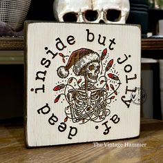 a wooden sign with a skull on it