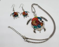 "Stunning turtle pendant, necklace, and earring set. 18\" necklace with extra 2 inches adjustable." Adjustable Multicolor Metal Jewelry Sets, Fuquay Varina Nc, Halloween Coffin, Turtle Pendant, Stretched Ears, Necklace And Earring Set, Black Earrings, Sugar Skull, Perfect Pair