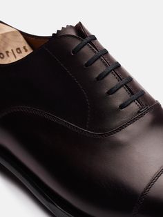 The Oxford is handcrafted to create a next level of sophistication and comfort. It's a confident, timeless and powerful shoe that does the speaking for you. Perfect for both formal and casual wear, these classics sharpen any modern man's shoe-arsenal.   Handmade in 128 steps. 61 dedicated working stations with artisans behind every stroke. Crafted using the Goodyear welt technique in Almansa, Spain. Elegant Business Oxford Shoes With Rubber Sole, Luxury Goodyear Welted Oxfords For Semi-formal Occasions, Luxury Plain Toe Dress Shoes, Goodyear Welted, Classic Oxford Dress Shoes For Galas, Timeless Italian Oxfords For Semi-formal Occasions, Luxury Plain Toe Dress Shoes With Goodyear Welted, Classic Italian Crafted Dress Shoes For Business, Elegant Oxford Shoes With Rubber Sole, Classic Dress Shoes With Leather Sole For Galas