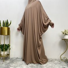 Description Details: Fabric: Polyester Pattern: Solid Color Occasion: Casual/Festival Season: Spring/Fall Fitness: Regular Sleeve Type:Bat Sleeves Sleeve Length: Long Sleeve Size Unit: CM Size Chart OneSize Length(CM) 135 Brown Long Dress For Eid, Long Brown Dress For Eid, Long Brown Dresses For Eid, Solid Color Long Maxi Dress For Eid, Brown Long Sleeve Khimar For Eid, Brown Long Sleeve Kaftan For Fall, Brown Long Thobe For Eid, Bohemian Style Long Brown Thobe, Bohemian Style Brown Long Thobe