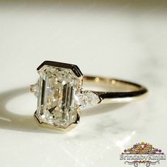 an engagement ring with a fancy diamond in the center