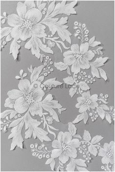 white lace with flowers on grey background