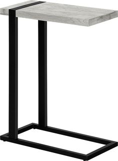 a white marble top table with black metal legs and a square shaped end table in the middle