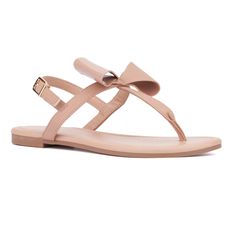 From the beach to the boardwalk, the Abril sandal is a quintessential summer essential. Its minimalistic design, adorned with a charming bow detail, adds a touch of femininity to any outfit. Perfect for warm weather, this versatile sandal effortlessly enhances your summer style, making it a must-have for your seasonal wardrobe. Summer Flat Adjustable T-strap Sandals, Summer Adjustable Flat T-strap Sandals, Casual Summer Flip Flops With Bow, Summer Beach Flip Flops With Bow, Summer Flip Flops With Adjustable Strap, Flat Sandals With Bow For The Beach, Summer Bow Flip Flops With Open Toe, Beach Open Toe Sandals With Bow, Chic T-strap Sandals For Summer Beach