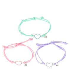 Best Friends Colored Crystal Hearts Cord Bracelets | You and your besties will look lovely and sweet with this matching set of bracelets. Silver open hearts are lined with colored crystals and attached to colored cord bands for charming best friends style. Includes one of each: pink, purple, and mint. Cincin Diy, Bracelets Bff, Pastel Heart, Bff Jewelry, Cute Friendship Bracelets, Bff Bracelets, Best Friend Bracelets, Pretty Jewelry Necklaces, Bff Necklaces