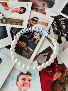 a bunch of pictures that are on top of a table with some pearls around them