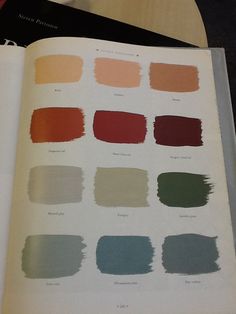 an open book with different shades of paint