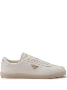 ivory white calf leather grained texture logo-debossed tongue enamel triangle logo to the side branded heel counter logo at the sole round toe front lace-up fastening branded insole flat rubber sole This piece comes complete with a protective dust bag. Classic High-top Sneakers With Logo, Luxury Low-top Sneakers With Textured Sole, Luxury Low-top Sneakers With Branded Insole, Luxury White High-top Sneakers With Embossed Logo, White Sole Leather Sneakers With Logo Detail, Classic Lace-up High-top Sneakers With Logo Detail, Classic Lace-up High-top Sneakers With Logo, Low-top Calf Leather Sneakers, Low-top Calf Leather Sneakers With Logo