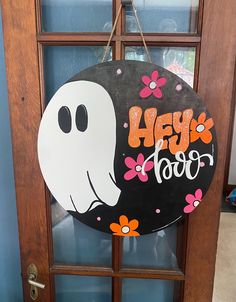 a door with a sign that says hey boo