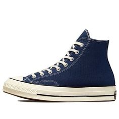 The Converse Chuck 70 Hi 'Navy' shoe is an essential for any fan of heritage style sneaker. This classic design offers a brilliant look that has been updated with modern details, such as a glossy egret midsole and star ankle patch. Built with premium recycled canvas and OrthoLite insoles to keep your feet comfortable, this retro shoe looks good while also providing optimal cushioning. With its archival color scheme, the Converse Chuck 70 Hi 'Navy' will elevate your style game no matter the occasion. (SNKR/Unisex/Classic/High Top) Classic Converse Sneakers For Sports, Navy Casual Custom Sneakers With Rubber Sole, Navy Casual Custom Sneakers With Round Toe, Navy Lace-up High-top Sneakers For Streetwear, Navy Lace-up Casual Custom Sneakers, Classic Blue Sneakers With Vulcanized Sole, Classic Mid-top Sneakers With Speckled Midsole, Converse High-top Sneakers With Cushioned Footbed For Streetwear, Casual Navy Sneakers With Rubber Sole