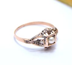 Unique antique style 14k gold ring with a real pearls 14k pink rose pearl Ring size is 7 us We make it any size you want Weight : 1.8 gram Top width : 1 cm Antique 14k Stamped Pearl Ring Gift, Rose Gold 14k Pearl Ring Gift, Rose Gold 14k Gold Pearl Ring Gift, Gift Rose Gold Pearl Ring In 14k Gold, Vintage 14k Rose Gold Rings In Gold Color, Vintage 14k Rose Gold Rings, Vintage 14k Rose Gold Rings For Formal Occasions, Anniversary Rose Gold Pearl Ring In 14k Gold, Victorian 14k Gold Pearl Ring Gift