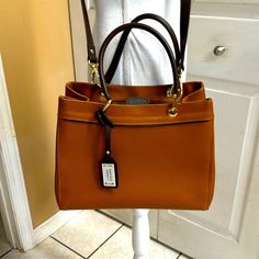 13 X 10 X 4.5 With A Handle Drop Of 6.6 With Crossbody Strap. This Beautiful Brown Leather Bag Is Nwot And Never Used. Gorgeous Lining. A Spot For Your Cell. Was A Bday Gift. Free Gifts With Purchase. Tan Satchel With Detachable Strap And Top Handle, Tan Top Handle Satchel With Detachable Strap, Tan Top Handle Satchel With Removable Pouch, Tan Handheld Bag With Detachable Strap, Tan Crossbody Satchel With Detachable Handle, Tan Satchel With Detachable Handle For Office, Tan Office Satchel With Detachable Handle, Elegant Cognac Shoulder Bag, Tan Office Satchel