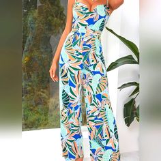 D&M Backless Tropical Print Cami Jumpsuit Size L. Has A Zipper On The Back 100% Polyester Non-Stretch. Sleeveless Printed Blue Jumpsuits And Rompers, Fitted Blue Beachwear Jumpsuits And Rompers, Blue Summer Party Jumpsuits And Rompers, Blue Party Jumpsuits And Rompers, Blue One-piece Jumpsuits And Rompers For Beach Season, Blue Floral Print Jumpsuits And Rompers For Party, Blue Printed Jumpsuits And Rompers For Beach, Blue One-piece Jumpsuit For Beach Season, Blue Printed Jumpsuits And Rompers For Summer