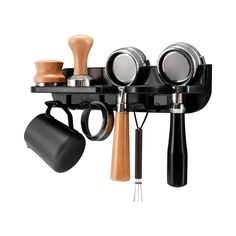 an assortment of kitchen utensils hanging from a wall mounted rack on a white background