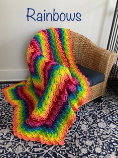 a colorful crocheted blanket sitting on top of a chair