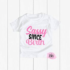 Sassy Since Birth, Funny Toddler Shirt, Funny Kids Shirt, Sassy Since Birth Shirt, Sassy Girl Shirt, Sassy Birthday Shirt, Sarcastic Shirt The design is adhered to the shirt with a premium professional heat press for optimum quality! I use TOP Quality Shirts. The shirts are VERY SOFT!! The shirts are true to size. Shirts ship out within 1 business days (MON-FRI) or less and take an additional 2-5 days to arrive. Each shirt is custom and made special just for your little one.  Subscribe to Our Yo Fitted Letter Print Tops For Birthday, Fitted White Top For Birthday, Cute White Party Shirt, Fitted Cotton Shirt For Birthday, Fitted Short Sleeve Tops For Birthday, Sassy Since Birth, Savage Shirt, Funny Baby Gifts, Funny Toddler Shirt