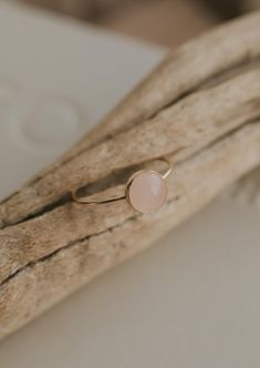 Our Rosie ring is made with a stunning Rose Quartz stone. Known as the crystal of unconditional love, it's said to boost feelings of self-love and foster loving relationships with others. It’s a crystal connected to the heart chakra which colors our life with compassion, love and beauty. 8mm round or 6x8mm round rose quartz stone. Ring band measures 1mm wide. Available in 14kt Gold Fill + Sterling Silver. Rediert pairs it with our Supermoon Ring and Teeny-Tiny Band. Kayla pairs it with two Confe Loving Relationships, Copper Uses, Everyday Wear Jewelry, Rose Quartz Stone, Midi Rings, Ring Sizer, Jewelry Cleaner, Relationships Love, Unconditional Love