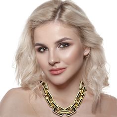 Make a bold statement with this stunning gold resin link chain necklace. Designed for those who embrace daring fashion, this lightweight piece offers a striking contrast that effortlessly elevates any outfit. Whether paired with a casual white t-shirt or dressed up for a business lunch, its versatile design ensures you stand out with confidence. A timeless accessory, this necklace is a must-have for anyone who adores statement jewelry with a classic edge. Avoid contact with water and cosmetics, such as creams or perfumes. Clean with a clean dry cloth. Modern Link Chain Necklace For Party, Modern Chain Link Necklace For Party, Modern Chain Link Necklace, Chunky Link Chain Necklace For Party, Trendy Link Chain Necklace, Modern Party Necklaces With Chain Strap, Trendy Link Chain Necklace For Party, Trendy Chunky Chain Necklace For Party, Trendy Chunky Chain Necklace With Rectangular Links