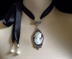 Vintage Cameo Necklace! Black ribbon cameo choker! The perfect Christmas gift for that very special person in your life! This is a beautiful, Victorian and vintage themed cameo "choker" necklace - the very intricately carved cameo is set in an antique silver frame with an adjustable black satin ribbon The perfect "wedding"...."birthday"or "Mother's Day gift"or just a lovely gift for that special loved one in your life.... The ribbon can be tied in a bow at the side or back of neck or just allow Cameo Choker, Victorian Choker, Grandmother Jewelry, Ribbon Necklace, Cameo Jewelry, Vintage Cameo, Cameo Necklace, Silver Choker, Popular Jewelry