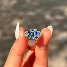 2.50 CT Asscher Cut Five Stone Ring-Square Cut Blue Moissanite Ring-Engagement Ring-14k Solid Gold Wedding Ring-Statement Ring-Trends Setter ❤ ITEM DETAILS:- ✦ Brand: The American Gold House (TAGH) ✦ Handmade, high-quality item! ✦ Material: Solid 10K/14K/18K Gold, 950 Platinum and 925 Sterling Silver ✦ Diamonds Type: Aquamarine ✦ Diamond Cut: 7.5 MM Asscher  ✦ Diamond Weight: 2.50 CT ✦ Main Stone Color: Blue (Lab Created) ✦ Width of Band: 1.8 MM (Bottom) ✦ Diamond Clarity: VVS/VS ❤ ACCENT/HALO DIAMONDS:- ✦ Side Stone Material: Moissanite Diamond ✦ Side Stone Shape: Baguette Cut ✦ Side Stone Carat Weight: 0.70 CT ✦ Side Stone Color: Colorless ✦ Diamond Clarity: VVS/VS   ------------------------------------------------------------------------------ 💎 Moissanite VS Diamond 💎 --------------- Asscher Cut Ring, Ring Square, Blue Moissanite, Asscher Diamond, Ring Trends, Wedding Rings Solitaire, Asscher Cut, Gold Wedding Rings, 14k Gold Ring