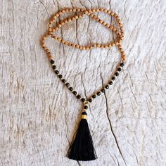 Inspired by the beauty of the Batuan village in Bali Ketut Sulastri designs a beaded necklace to add harmony to your wardrobe. Beads of black onyx and cumala wood alternate with beads crafted of 18k gold plated sterling silver. A black tassel dangles at the pendant. Tasbeeh Aesthetic, Women's Slippers, Mala Necklace, Onyx Bead, Buy Gold, Mala Beads, Jewelry Packaging, Necklace Sizes, Leather Necklace