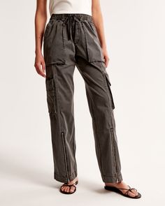 Elevate your casual wardrobe with the Abercrombie & Fitch Women's Pull-On Wide Leg Cargo Pant in a sophisticated dark grey. These pants blend functionality with style, perfect for the modern woman on the go.

- Size: M SHORT
- Color: Dark Grey
- Material: Body and pocket bag made from cotton
- Gender: Female
- Age Group: Adult
- Features: High-rise, wide-leg silhouette, elasticated waistband with functional drawcords, cargo-inspired details, zipper detail at cuffs, multiple pockets

Crafted from Elevated Casual Wide Leg Cargo Bottoms, Utility Cotton Parachute Pants With Elastic Waistband, Cotton Utility Parachute Pants With Elastic Waistband, Cotton Bottoms With Functional Drawstring For Spring, Spring Cotton Bottoms With Functional Drawstring, Straight Leg Cotton Bottoms With Drawstring, Utility Bottoms With Drawstring And Loose Fit, Utility Bottoms With Drawstring And Loosely Fitted Hips, Relaxed Fit Cotton Pants With Functional Drawstring