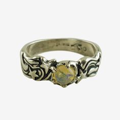 This vintage sterling silver ring has a celestial motif and features a foil backed jelly opal "moon" flanked by shooting stars.  The surface of the ring is deeply grooved with the upper portions having a high polish that serves to highlight the design so it stands out from the blackened background.  The front edges of the band have a wavy shape that corresponds with the shooting stars and their tails, giving a visual representation of the motion of the stars as they hurtle through space. The ring is in good condition with no repairs and the prong-set stone is securely mounted.  As a vintage piece, there are signs of age present including traces of tarnish and minor wear to the band including nicks/scratches.  It should also be noted traces of foil are visible under magnification around the Jelly Opal, Vintage Sterling Silver Rings, Star Ring, Visual Representation, Shooting Stars, Makers Mark, Vintage Sterling Silver, Sterling Silver Ring, Prong Setting