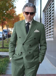 If you treat yourself to some new tailoring, you can't go wrong with our Sage Green Double Breasted Jacket, which offers a trendy statement-making ensemble that is both timeless and adaptable. Our super 120's wool jacket is made with a blend of wool and poly, whereas a solid pattern and green hue instantly give the outfit an eye-catching twist. An excellent option for a fantastic night out or attending a wedding.    Look Includes   Sage Green Fabric  Double Breasted Jacket Style  Peak Lapel   Horn Royal Black  Buttons  Single Vent  Three Cuff Buttons   Click 'Customize Now' to modify the look if needed.   Lining: Viscose; Dry Clean. Spring Fitted Pea Coat With Notch Lapel, Wool Suit With Suit Collar For Fall, Wool Suits With Suit Collar For Fall, Fall Wool Suit With Suit Collar, Wool Suits For Fall, Fitted Wool Sport Coat For Semi-formal Occasions, Fall Wool Suits, Tailored Wool Suits For Fall, Tailored Double Breasted Suit For Fall With Long Sleeves