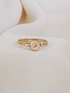 The beautiful initial ring with your birthstone, it's a stunning set of rings, you won’t take off. Personalized by hand with your favorite initial and the beautiful birthstone. A successful ring with a texture that creates its unique shine. This initial ring can be combined with our dainty rings to perfection with our most delicate stackable rings. It also looks minimal and effortless worn alone. * CZ Stone Options: Jan - Garnet Feb - Amethyst Mar - Aquamarine Apr - Diamond May - Emerald Jun - L 14k Gold Stackable Rings With Initials, 14k Rose Gold Initial Ring, Gold Open Initial Ring With Birthstone, Dainty Initials Jewelry For Promise, Gold Initial Ring With Birthstone, Dainty Yellow Gold Initial Ring With Birthstone, Personalized Gold Initial Ring, Gold Dainty Initial Ring With Birthstone, Personalized Dainty Initial Ring