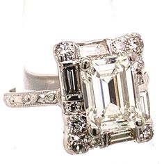 Gia Certified Emerald Cut Art Deco Diamond Ring, Platinum Diamond Ring With Baguette Emerald Cut, Art Deco Emerald Cut Diamond Ring With Baguette Diamonds, Gia Certified Classic Rectangular Diamond Ring, Classic Gia Certified Rectangular Diamond Ring, Classic Octagon Diamond Ring With Baguette Diamonds, Classic Emerald Ring With Baguette Diamonds In Radiant Cut, Classic Emerald Cut Baguette Diamond Ring, Art Deco Emerald Cut Diamond Ring With Halo Setting