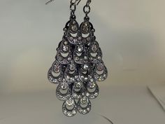 These peacock inspired rhinestone (CZ) dangle wire earrings are perfect to peek behind your hair and make a little party on your ears. Condition is good to very good. Teardrop Metal Chandelier Earrings For Party, Metal Teardrop Chandelier Earrings For Party, Metal Teardrop Party Earrings With Ear Wire, Teardrop Chandelier Earrings For Party, Party Drop Chandelier Earrings With Ear Wire, Party Teardrop Chandelier Earrings, Southern Gothic, Wire Earrings, Etsy Earrings Dangle