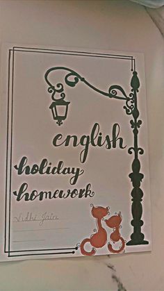 an english holiday homework sign hanging from a lamp post on the side of a building