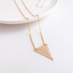 Gold Triangle Necklace - Gold Geometric Pendant - Delicate Necklace - Minimal Necklace - Minimalist Jewelry - Layering Necklace - Classic - Made to order at the length you choose - Delicate High quality 14K gold fill Chain with triangle shaped pendant. - The triangle charm is flat & light wight. It's also made of gold fill. - Beautiful on its own or layered with other necklaces. - This product comes in a gift box with the brand's logo and you can ask for gift wrap too (see picture). Color's Mens Choker Necklace, Jewelry Layering Necklace, Pendant Delicate, Jewelry Layering, Necklace Minimalist Jewelry, Mens Chain Bracelet, Women's Necklace, Gold Triangle, Minimal Necklace