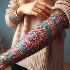 a woman's arm with colorful tattoos on it