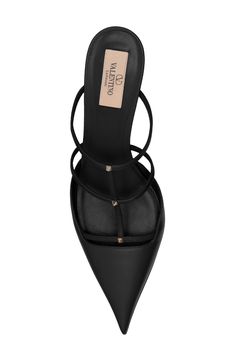 A trio of signature pyramid studs punctuate the wispy straps of this Italian-crafted leather mule sharpened by a pointy toe. 2 3/4" (70mm) heel Leather upper, lining and sole Made in Italy Designer Shoes Fall Flats 2024, Close Toed Heels, Manolo Heels, Heels Accessories, Elegant Shoes Heels, Valentino Heels, Black Heeled Sandals, Pointy Pumps, Pointy Heels